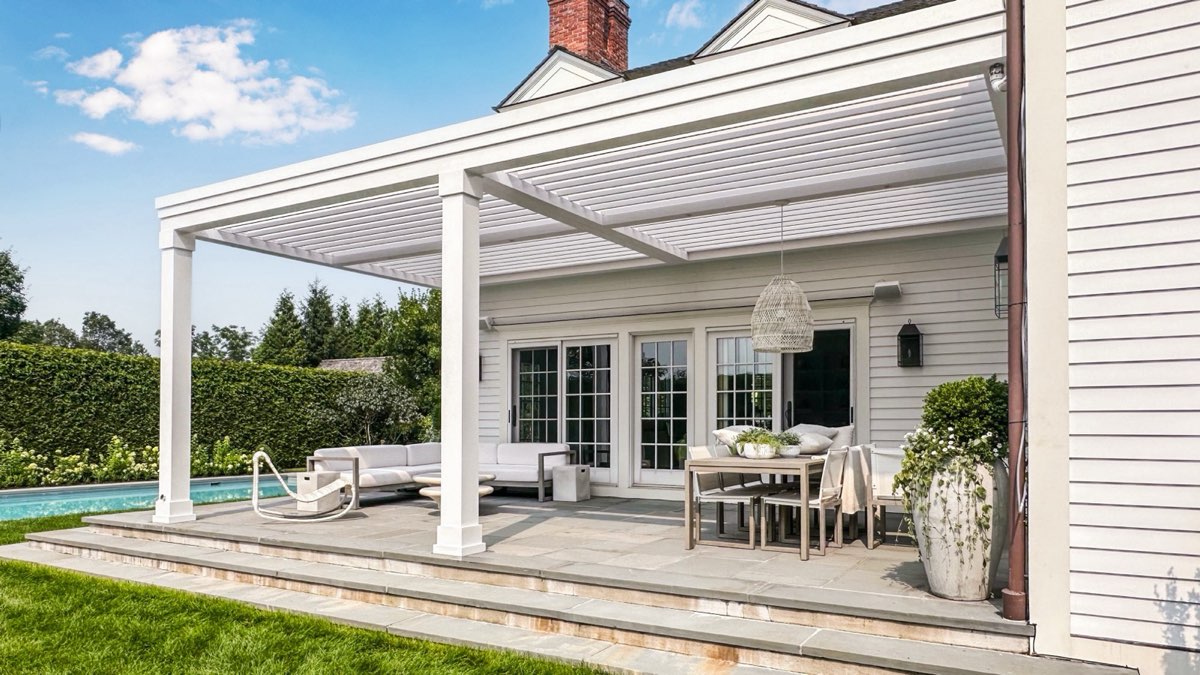 A transitional-style louvered pergola by SJB Outdoor Living